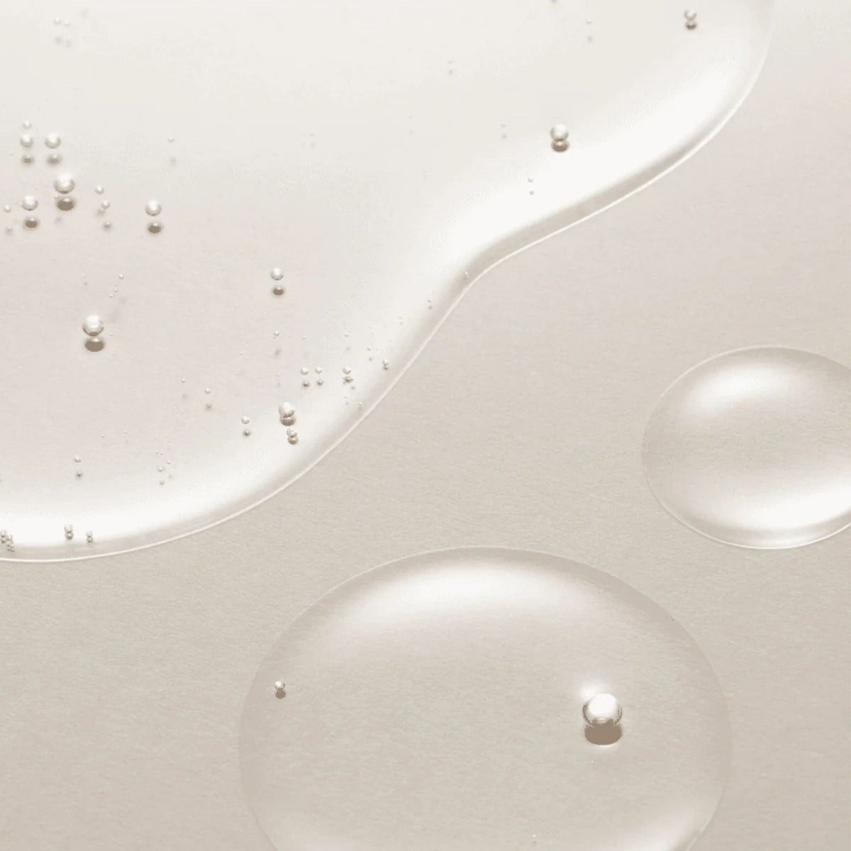 Refect Beauty AXIS-Y Artichoke Intensive Skin Barrier Ampoule serum texture showing clear hydrating droplets on skin