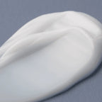 Refect Beauty AXIS-Y TXA 2.5% Intensive Brightening Cream texture swatch showing a smooth white moisturizing balm