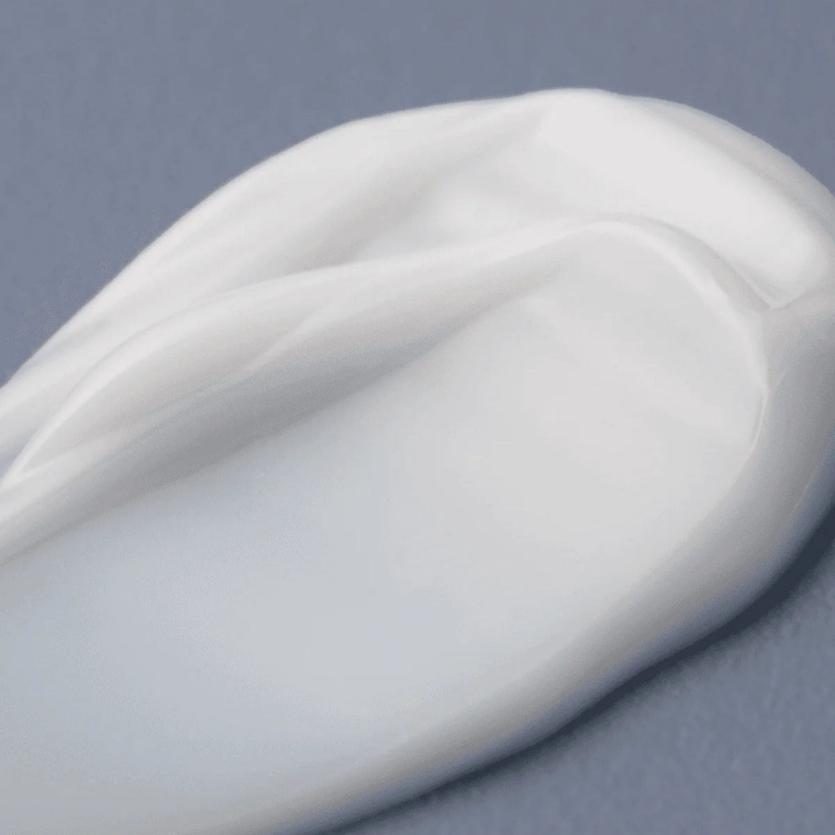 Refect Beauty AXIS-Y TXA 2.5% Intensive Brightening Cream texture swatch showing a smooth white moisturizing balm