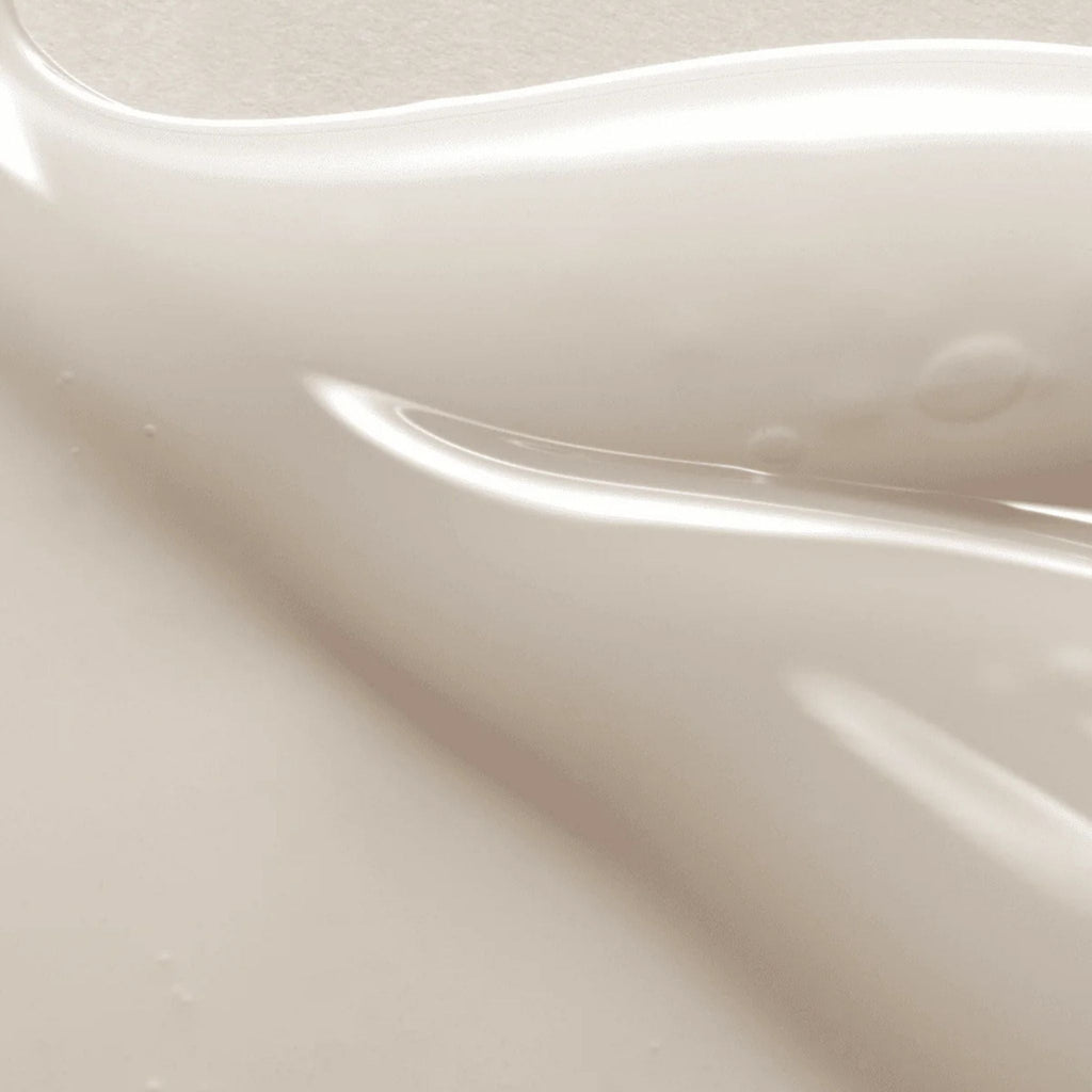 Refect Beauty AXIS-Y Dark Spot Correcting Glow Serum texture showing a smooth, lightweight, off-white gel consistency.