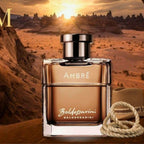 Refect Beauty Baldessarini Ambre Eau de Toilette for men in a square glass bottle against a desert sunset background.