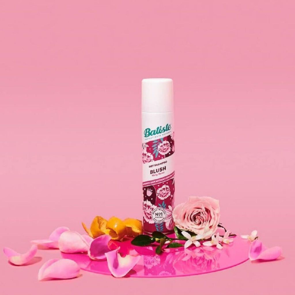 Refect Beauty Batiste Blush dry shampoo spray can surrounded by pink rose petals on a matching pink background.