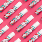 Refect Beauty Batiste Fruity & Cheeky Cherry dry shampoo cans arranged in a pattern on a bright pink background