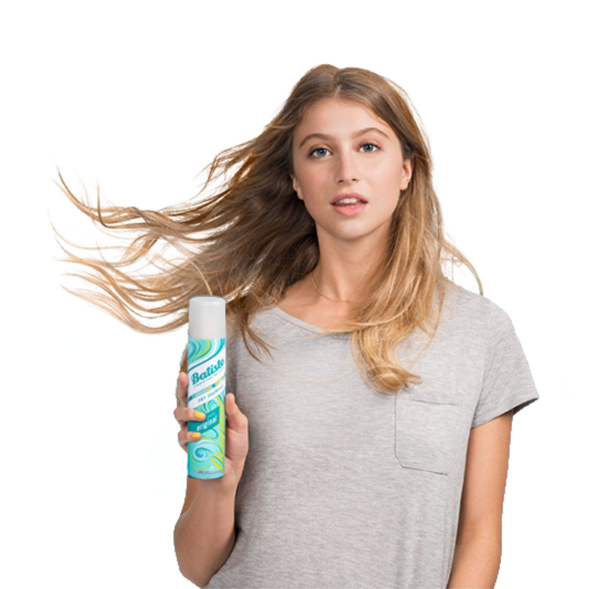 Refect Beauty model holding a can of Batiste Original Clean & Classic dry shampoo with wind-swept hair