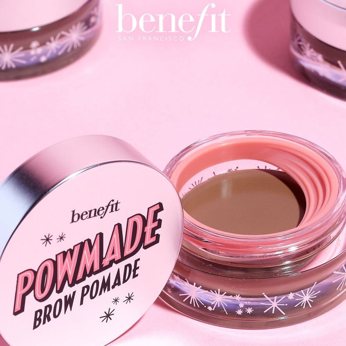Refect Beauty Benefit Cosmetics Pow Made Brow Pomade in a small glass jar with a pink lid on a soft pink background