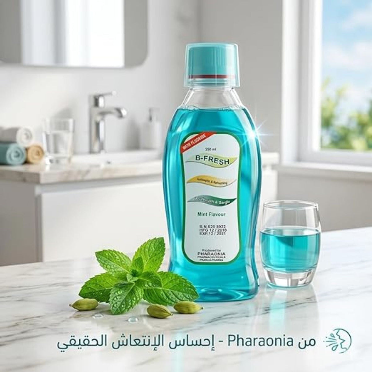 Refect Beauty B-Fresh mint fluoride mouthwash in a blue bottle with a small glass on a bathroom vanity with mint leaves