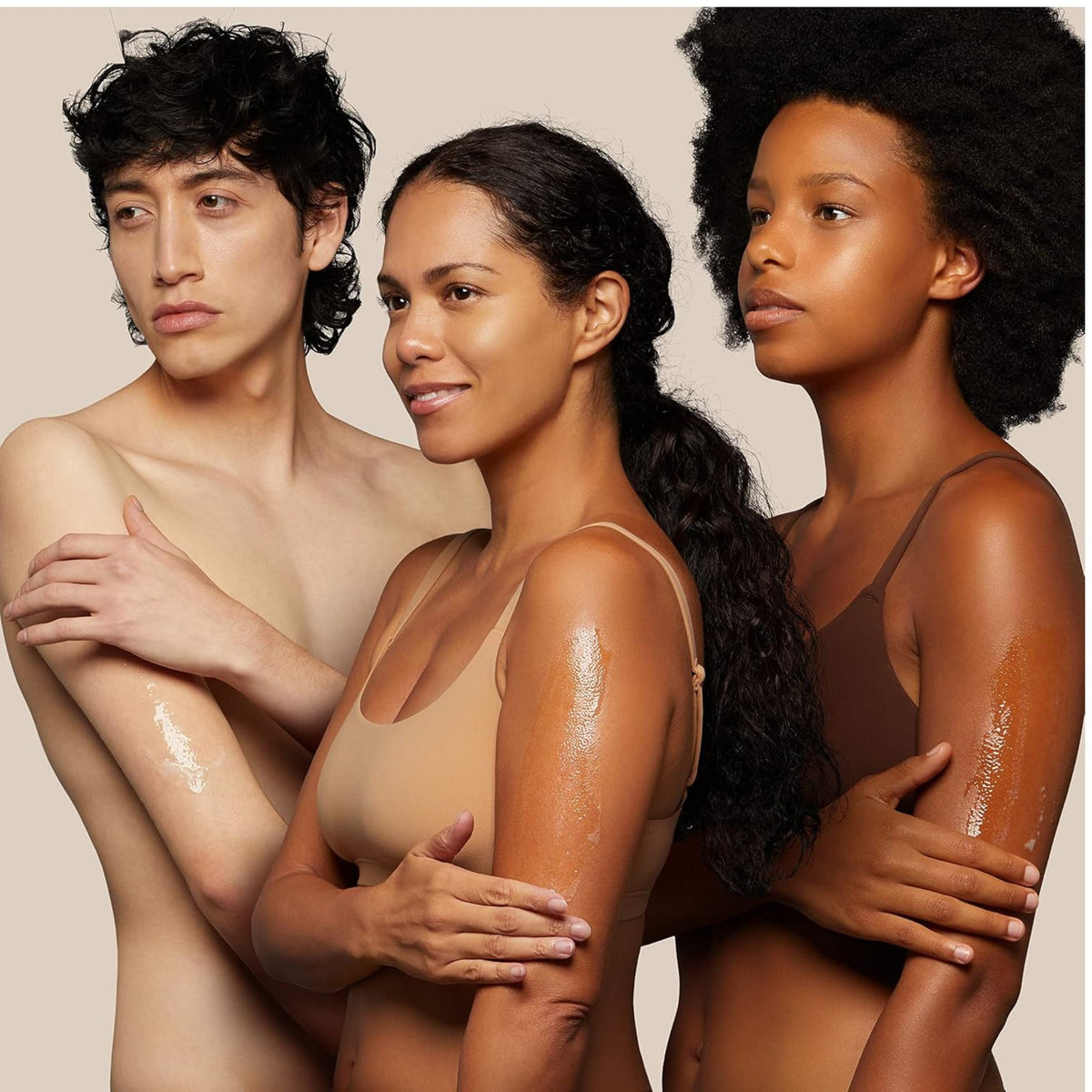 Refect Beauty Bioderma Atoderm shower gel applied to the arms of three diverse models with glowing, hydrated skin.