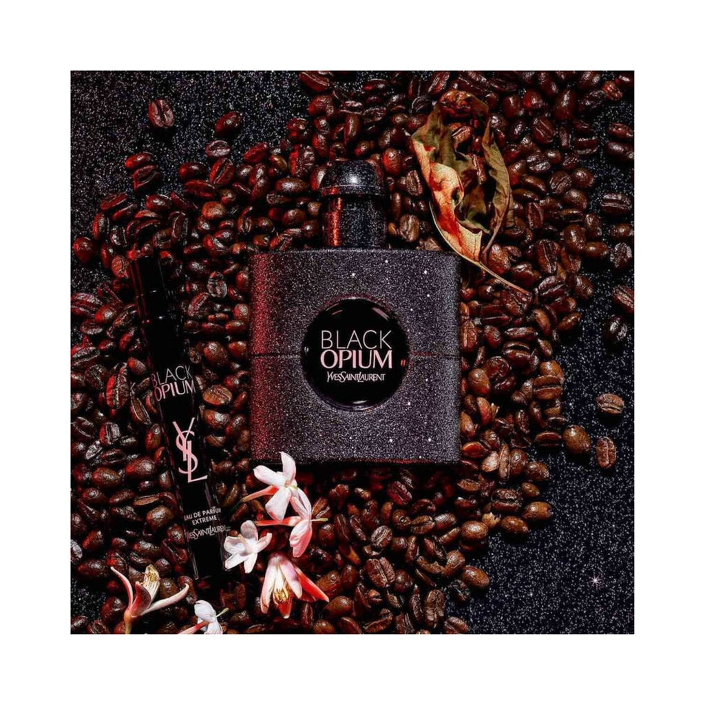 Refect Beauty Yves Saint Laurent Black Opium Extreme perfume bottle and travel spray surrounded by coffee beans