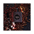 Refect Beauty Yves Saint Laurent Black Opium Extreme perfume bottle and travel spray surrounded by coffee beans