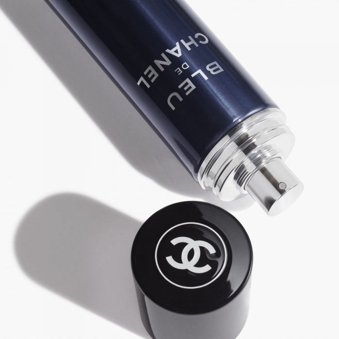 Refect Beauty Bleu de Chanel All-Over Spray in a dark blue bottle with a black cap featuring the iconic logo.