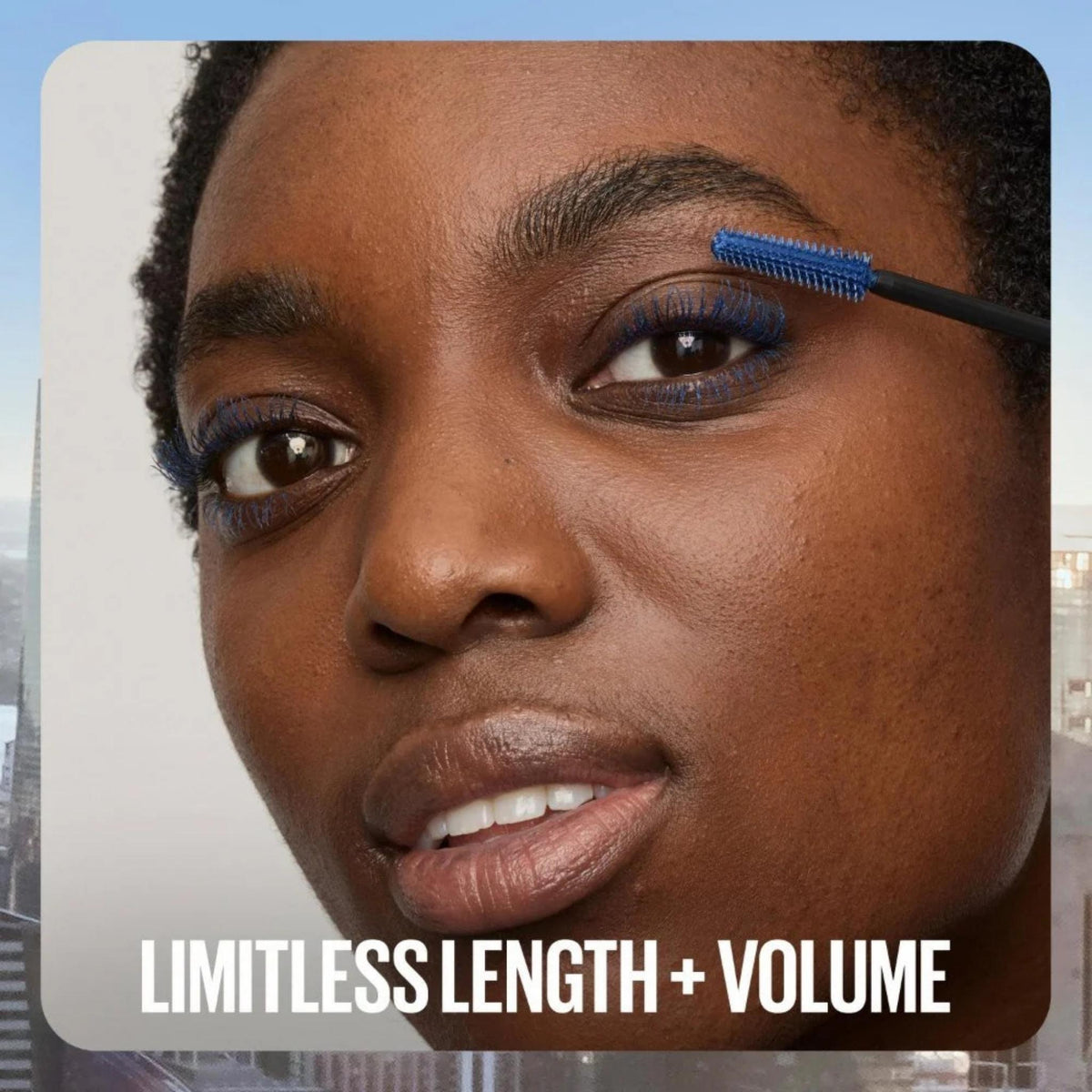 Refect Beauty model applying vibrant blue Maybelline Sky High mascara to lashes for length and volume