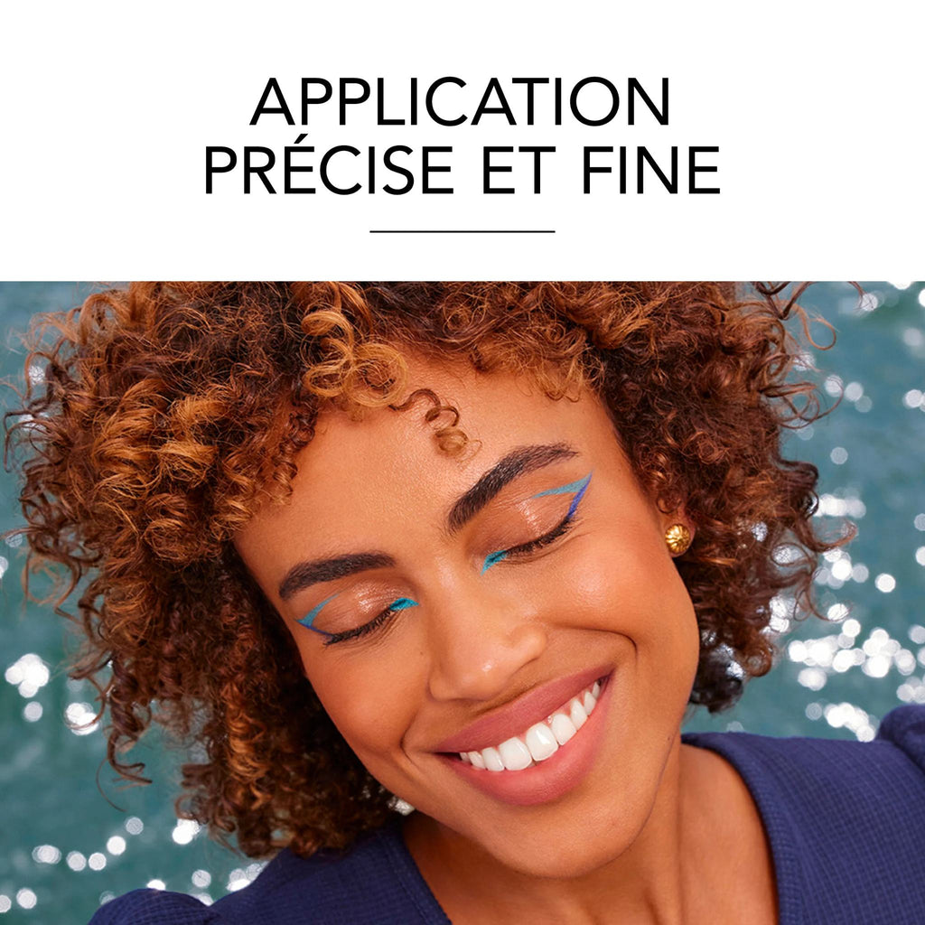 Refect Beauty model with curly hair wearing bright blue winged eyeliner applied with Bourjois Contour Clubbing pencil