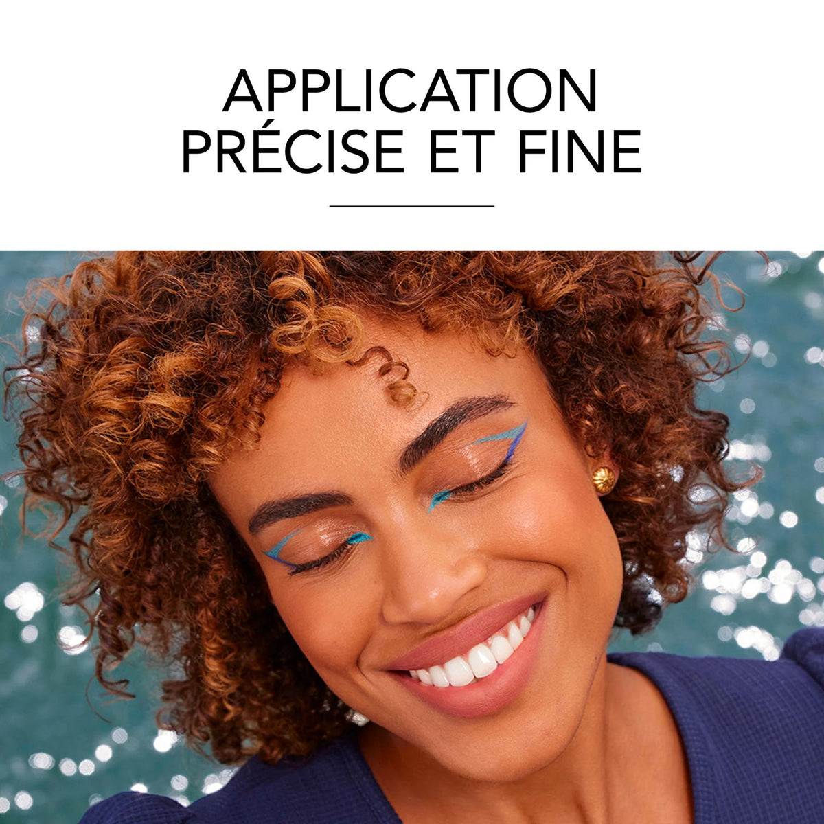 Refect Beauty model with curly hair wearing bright blue winged eyeliner applied with Bourjois Contour Clubbing pencil