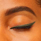 Refect Beauty Bourjois Contour Clubbing waterproof eyeliner in dark green applied as a sharp wing on a closed eyelid.