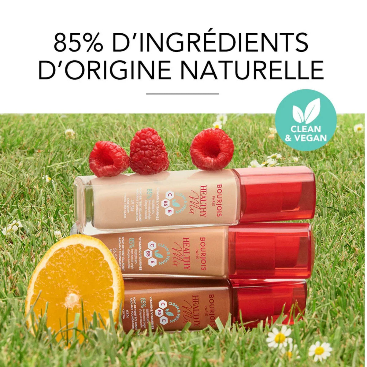 Refect Beauty Bourjois Healthy Mix Clean Foundation bottles with fresh raspberries and orange on green grass.