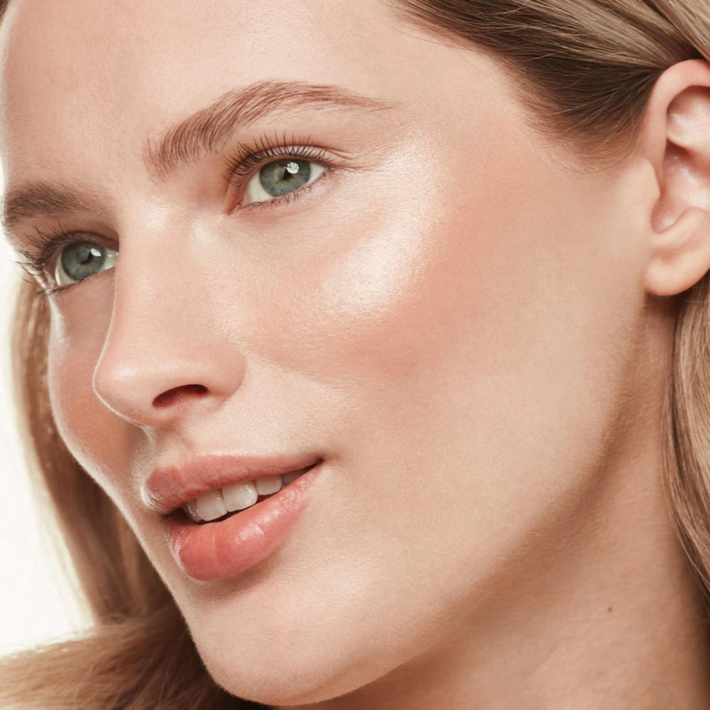 Refect Beauty model wearing Bourjois Maxi Round Pot Highlighter for a radiant, luminous glow on her cheekbones.