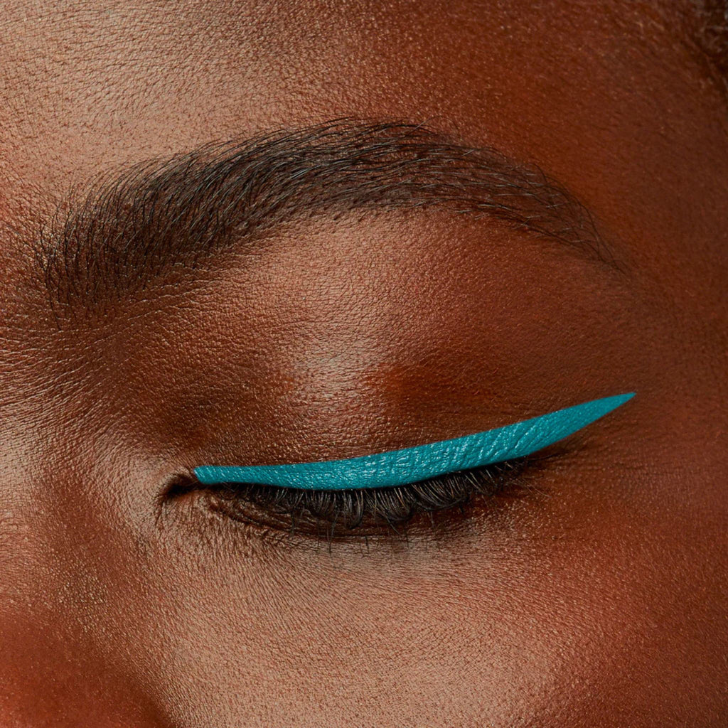 Refect Beauty Bourjois Contour Clubbing waterproof eyeliner in vibrant teal applied as a sharp wing on dark skin