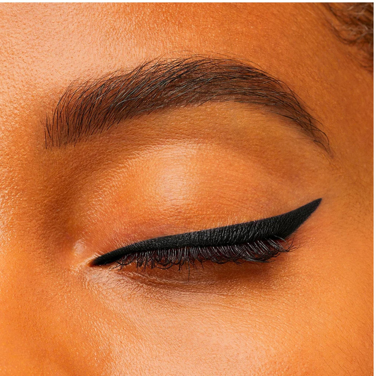 Refect Beauty Bourjois Contour Clubbing waterproof black eyeliner applied as a sharp winged line on a closed eyelid