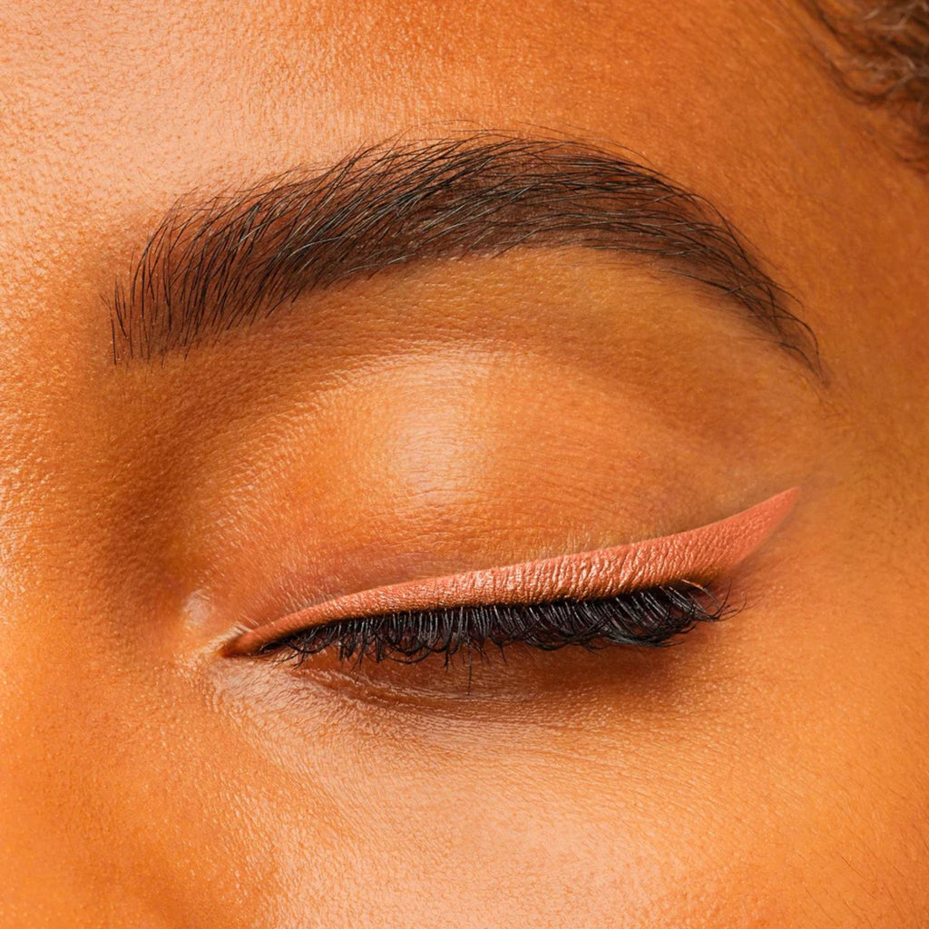 Refect Beauty Bourjois Contour Clubbing waterproof eyeliner in a warm peach shade applied as a precise winged liner.