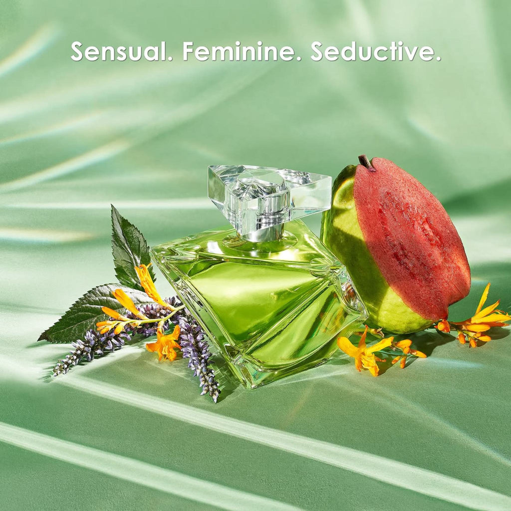 Refect Beauty Britney Spears Believe Eau de Parfum bottle with guava and floral accents on a green silk background