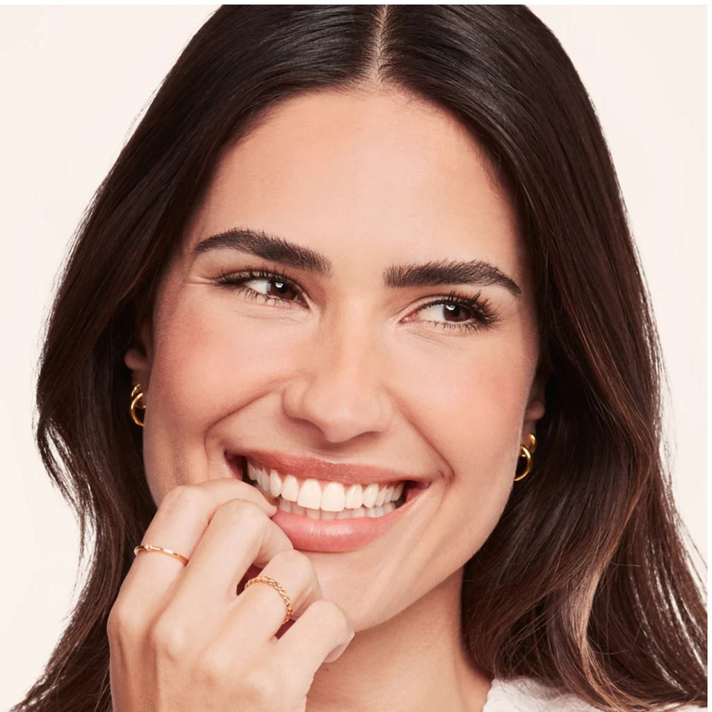 Refect Beauty model with perfectly shaped, lifted brows using Bourjois Brow Reveal Wax for a natural laminated look.
