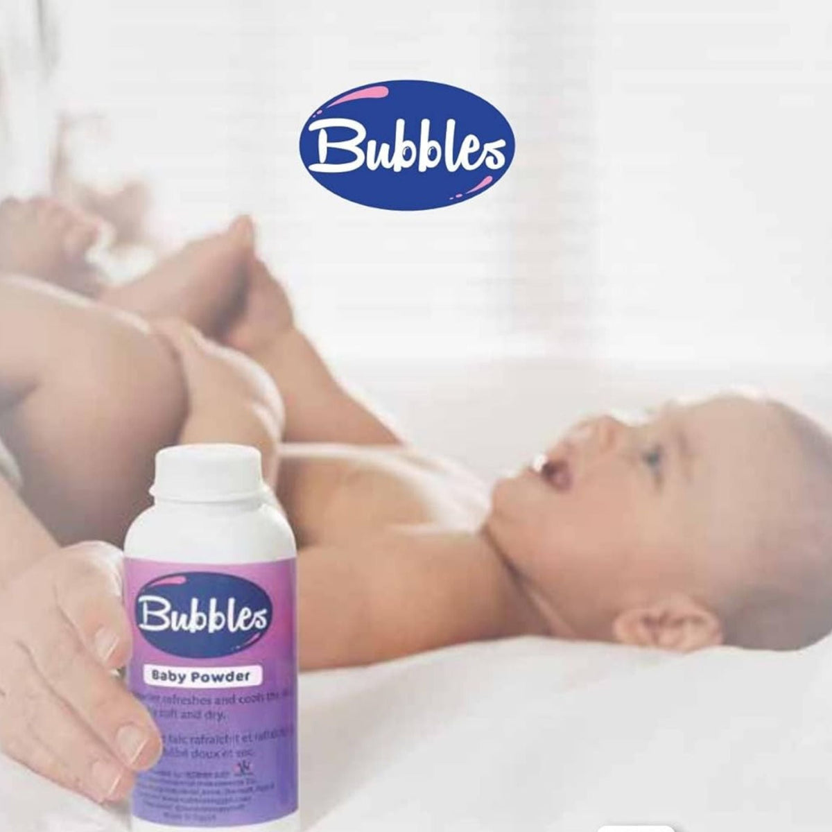 Refect Beauty Bubbles Baby Powder bottle held by a parent near a baby lying on a soft white bed