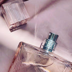 Refect Beauty Burberry Brit Sheer Eau de Toilette bottle with a textured glass cap in a soft pink light setting