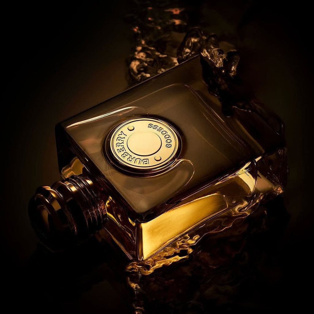Refect Beauty Burberry Goddess Parfum bottle with golden liquid, elegant glass design, and dark moody lighting.