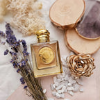 Refect Beauty Burberry Goddess Eau de Parfum bottle surrounded by dried lavender, wood slices, and white stones