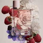 Refect Beauty Burberry Her Eau de Parfum bottle surrounded by fresh raspberries, blackberries, and white flowers.