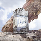 Refect Beauty Bvlgari Man Rain Essence Eau de Parfum bottle with water droplets on a textured tree bark background