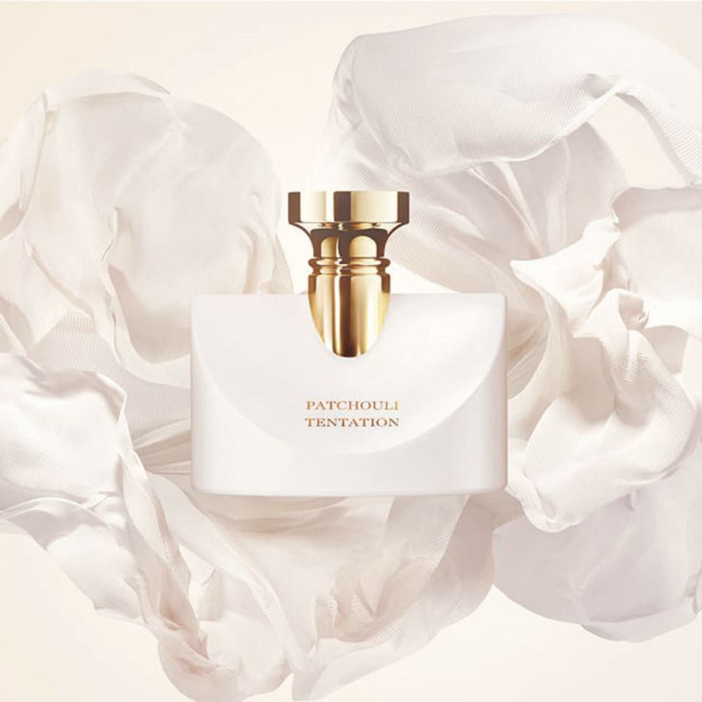 Refect Beauty Bvlgari Splendida Patchouli Tentation perfume bottle with gold cap surrounded by flowing white fabric