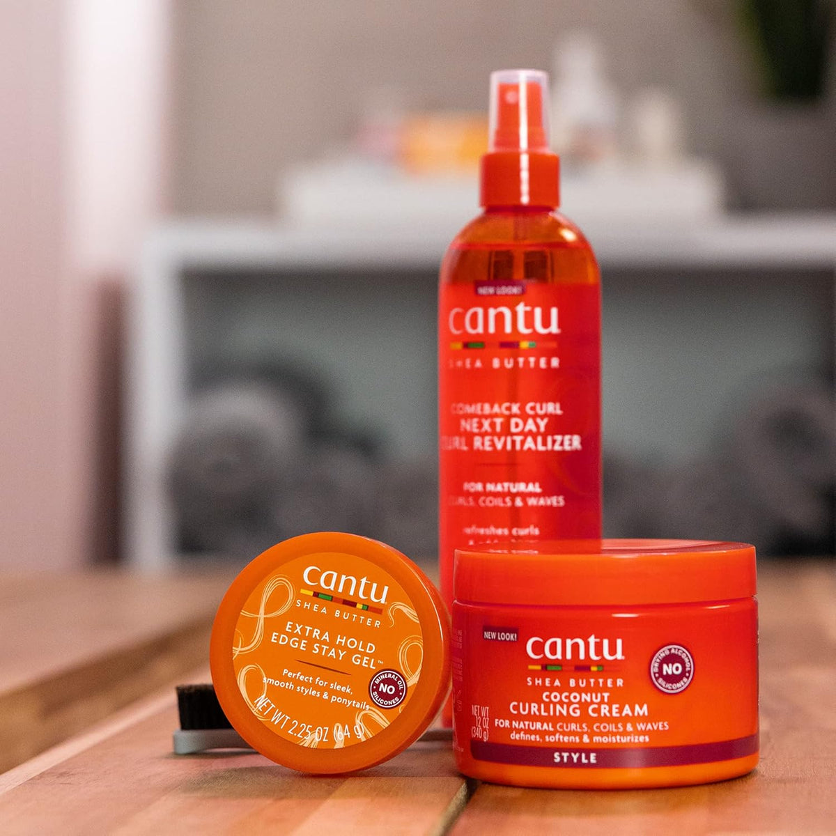 Refect Beauty collection of Cantu Shea Butter hair care products including curl revitalizer spray, gel, and cream.