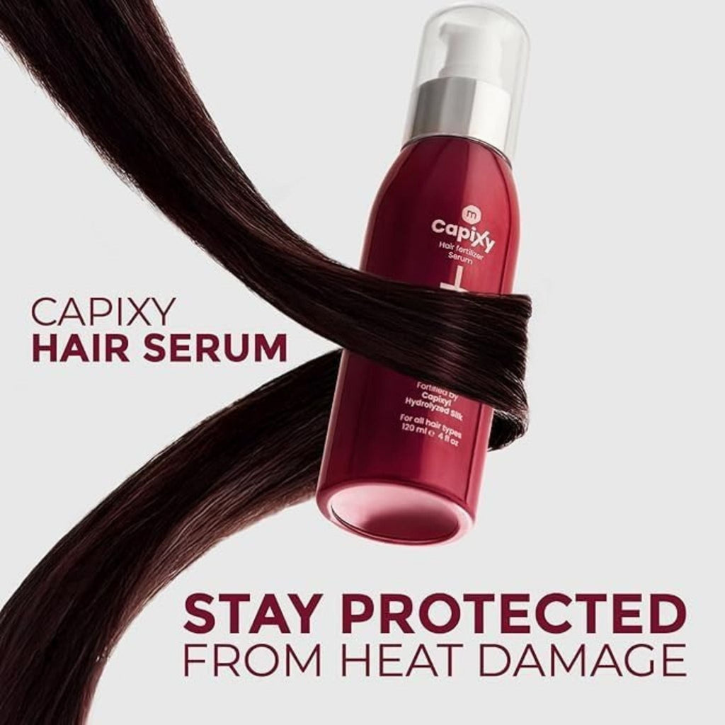 Refect Beauty Capixy hair treatment serum bottle wrapped in a strand of dark hair against a light background