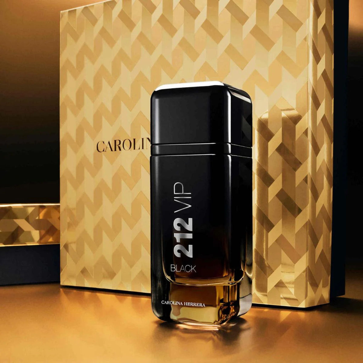 Refect Beauty Carolina Herrera 212 VIP Black Eau de Parfum bottle standing in front of a gold patterned gift box