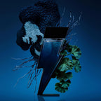 Refect Beauty Carolina Herrera Bad Boy Cobalt perfume bottle shaped like a lightning bolt against a dark blue background
