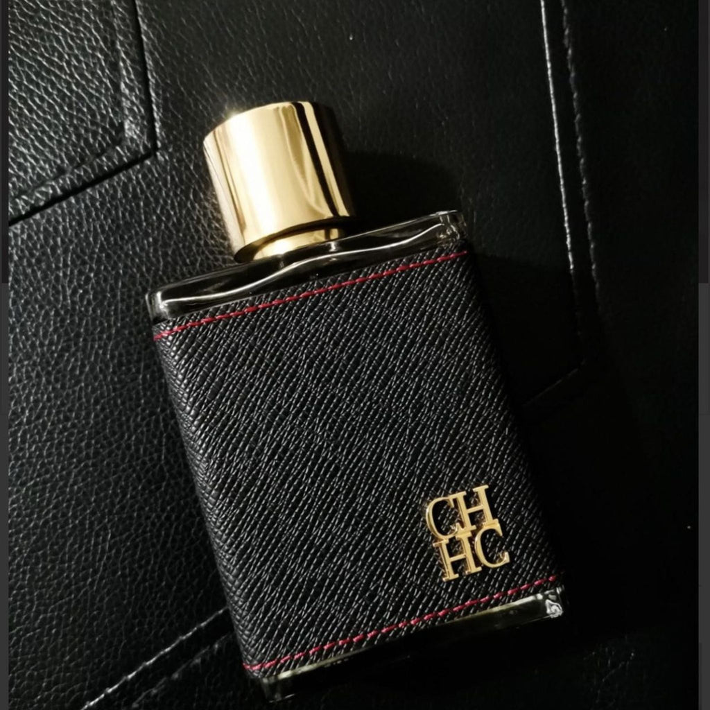Refect Beauty Carolina Herrera CH Men Eau de Toilette in a black leather-wrapped bottle with a gold cap.