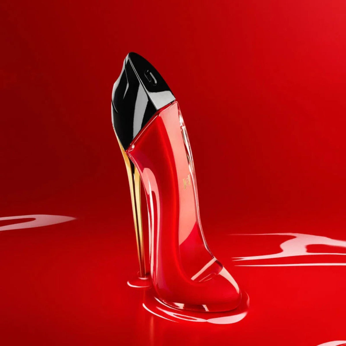 Refect Beauty Carolina Herrera Very Good Girl perfume bottle shaped like a red stiletto heel on a glossy red surface