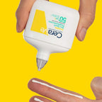 Refect Beauty CeraVe Invisible Dry Touch Fluid Sunscreen SPF 50+ being applied to a finger against a yellow background