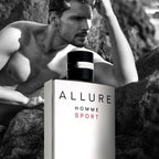 Refect Beauty Chanel Allure Homme Sport Eau de Toilette bottle next to a shirtless man on a rocky beach in black and white