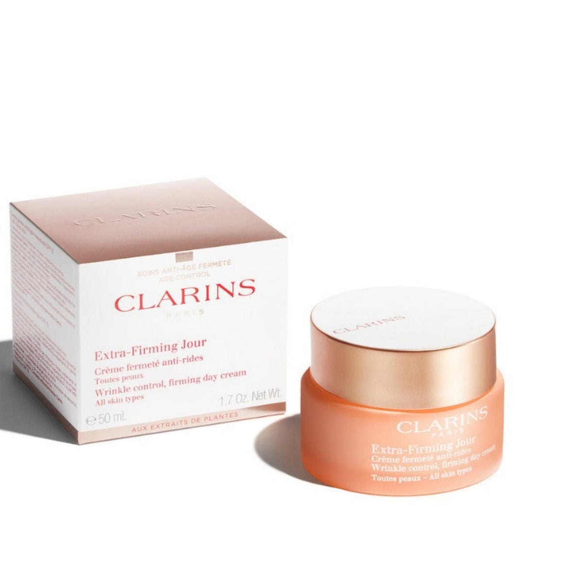 Refect Beauty Clarins Extra-Firming Day Cream with SPF 15 in a peach-colored jar next to its matching product box.