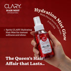 Refect Beauty Clary hydrating hair mist spray bottle held in hand, featuring a red floral design and spray nozzle.