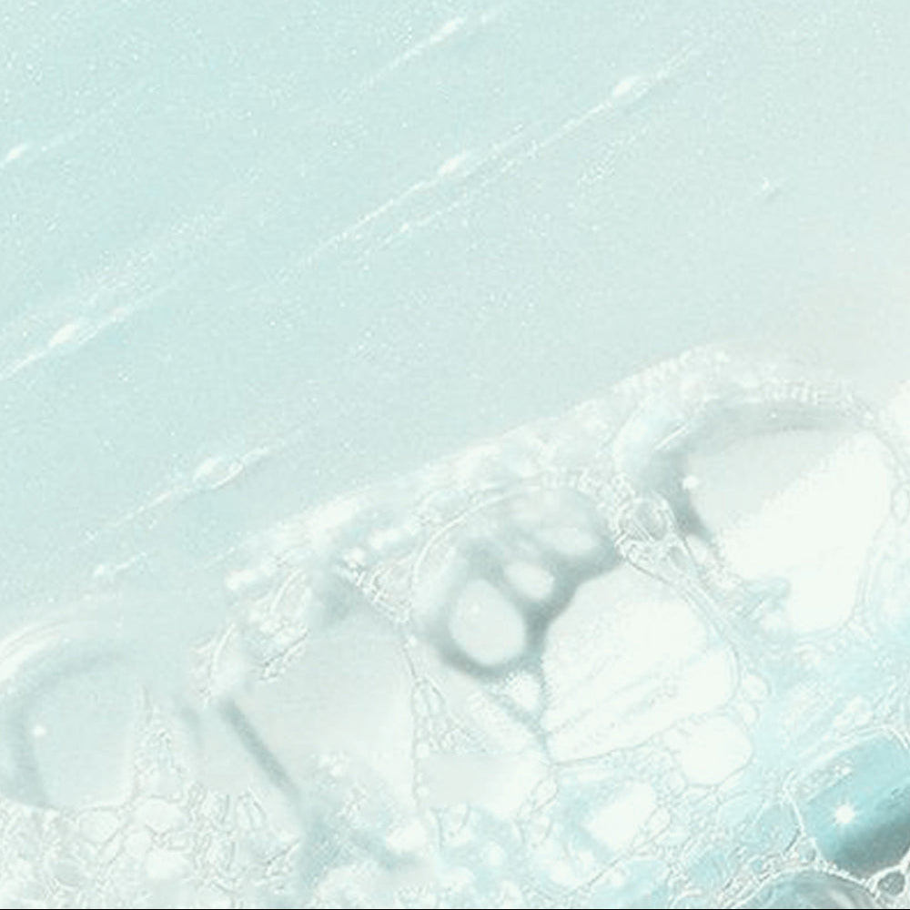 Refect Beauty Dermactive Acti-Clear foaming gel texture showing light blue bubbles and a smooth cleansing consistency