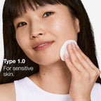 Refect Beauty model applying Clinique Clarifying Lotion 1.0 exfoliating toner with a cotton pad to her face