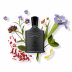 Refect Beauty CREED Green Irish Tweed perfume bottle surrounded by iris, violet leaves, sandalwood, and lemon peel.