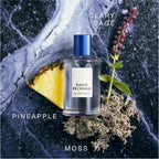 Refect Beauty David Beckham Classic Blue Eau de Toilette bottle surrounded by pineapple, clary sage, and moss