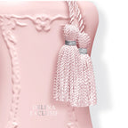 Refect Beauty Parfums de Marly Delina Exclusif perfume bottle in matte pink with decorative silver-trimmed tassels