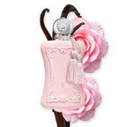 Refect Beauty Parfums de Marly Delina Exclusif perfume bottle in matte pink with a silver cap and decorative tassel