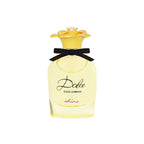 Refect Beauty Dolce & Gabbana Dolce Shine Eau de Parfum in a yellow glass bottle with a floral cap and black ribbon.