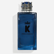 Refect Beauty Dolce & Gabbana K Eau de Parfum in a blue glass bottle with a distinctive silver crown-shaped cap.